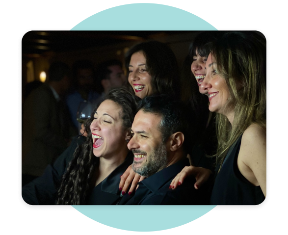 Photo of employees smiling and having fun taking a group photo