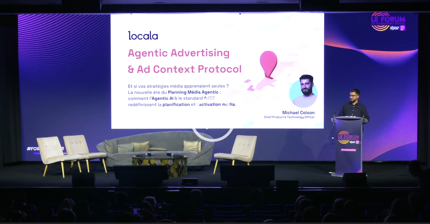 Photo of Michael Colson, chief technology officer at locala on a stage presenting his master class